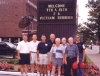 Part of the 1995 reunion group in front of the hotel sign